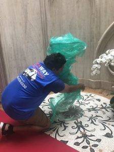 Wrapping glass furniture in bubble wrap for safety